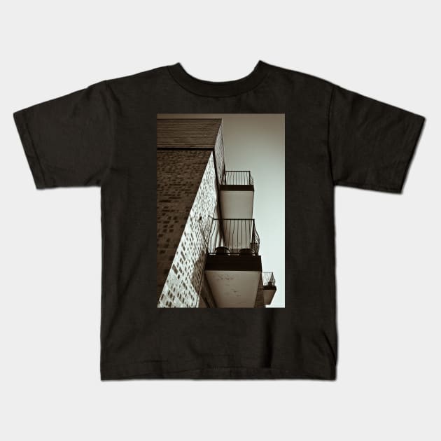 Balconies Kids T-Shirt by GeoffCarpenter